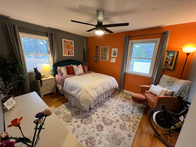 bedroom featuring light wood-type flooring and ceiling fan