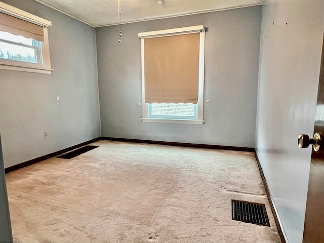 unfurnished room featuring carpet floors