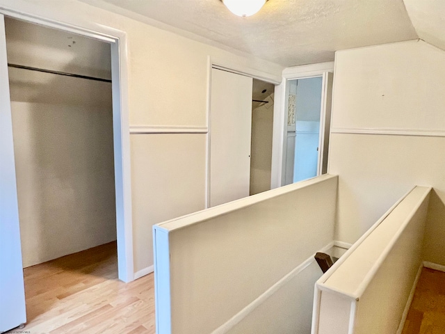 corridor featuring light hardwood / wood-style floors