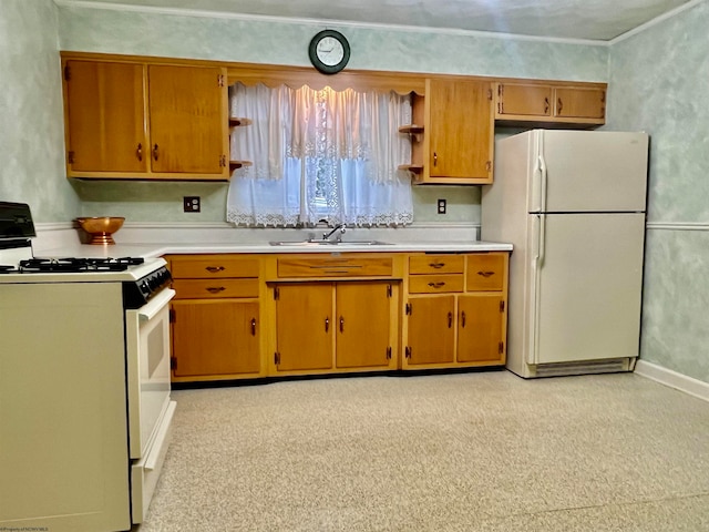 kitchen featuring white appliances and sink