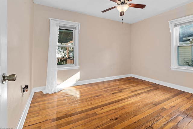 empty room featuring ceiling fan and light hardwood / wood-style flooring