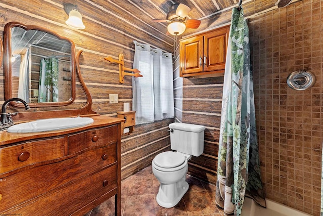 bathroom featuring wood walls, plenty of natural light, ceiling fan, and walk in shower