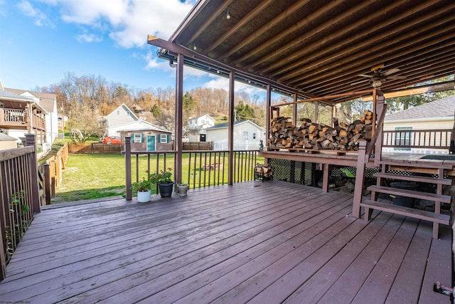 deck featuring a yard and a storage shed