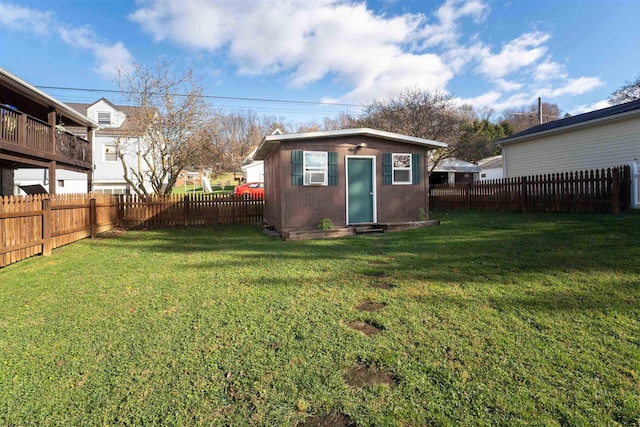 view of outbuilding with a yard