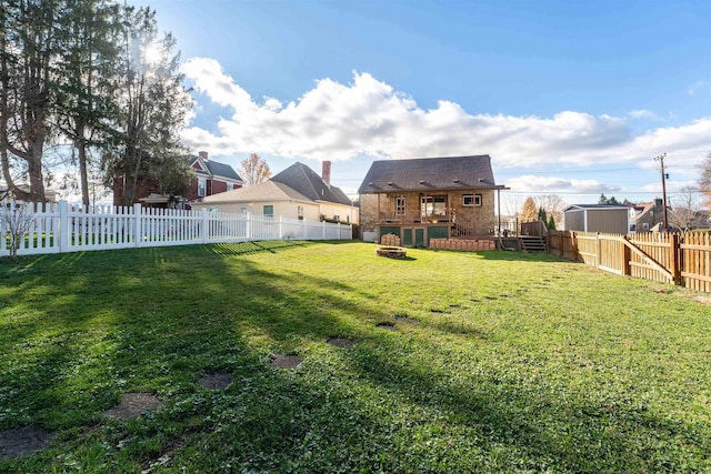 view of yard featuring a wooden deck