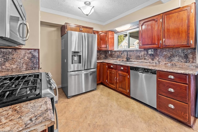 kitchen with sink, crown molding, a textured ceiling, decorative backsplash, and appliances with stainless steel finishes