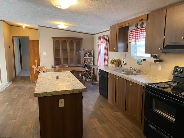 kitchen with sink, dark wood-type flooring, black appliances, a textured ceiling, and decorative backsplash