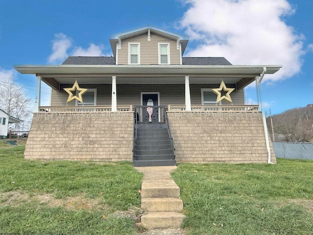 view of front of property featuring a porch and a front yard