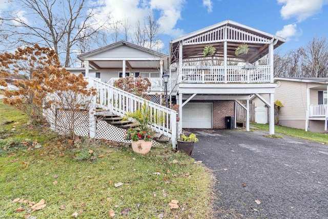 view of front of house featuring covered porch and a garage