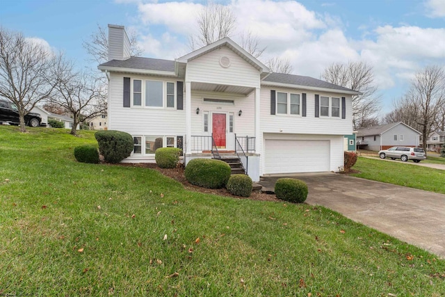 split foyer home with a garage and a front yard