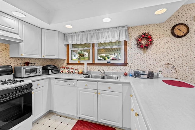 kitchen with white cabinetry, sink, and white appliances