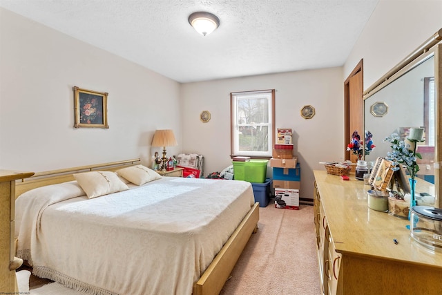 carpeted bedroom with a textured ceiling