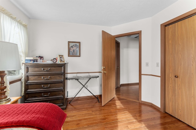 bedroom featuring light hardwood / wood-style flooring and a closet