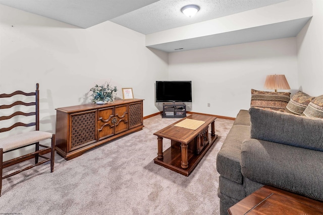 carpeted living room with a textured ceiling