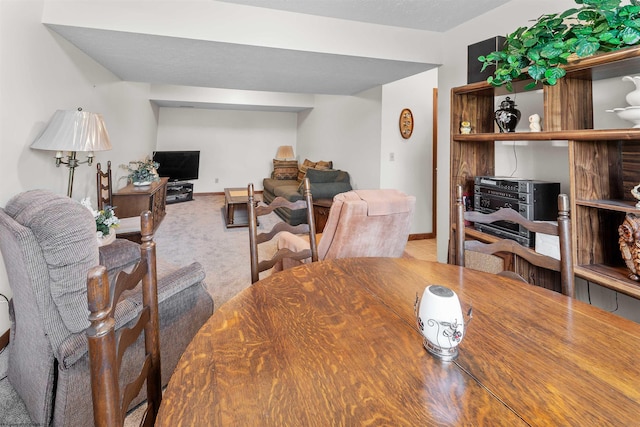 view of carpeted dining area