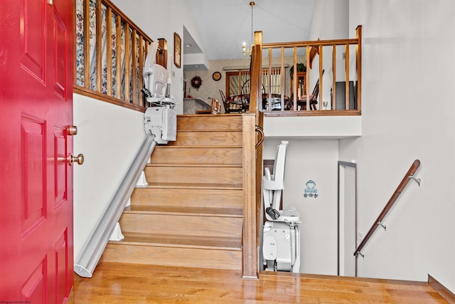 stairs featuring hardwood / wood-style flooring