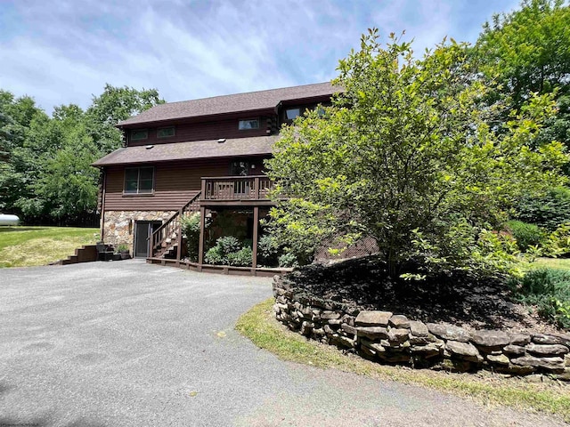 view of front of home with a wooden deck