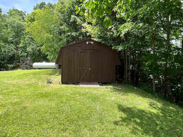 view of outbuilding featuring a yard