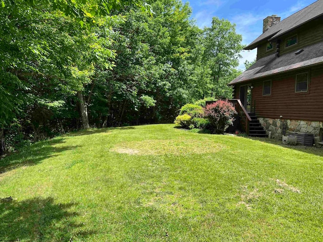 view of yard featuring a wooden deck