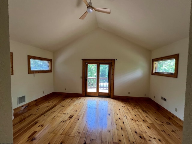 unfurnished room with ceiling fan, light hardwood / wood-style floors, and lofted ceiling