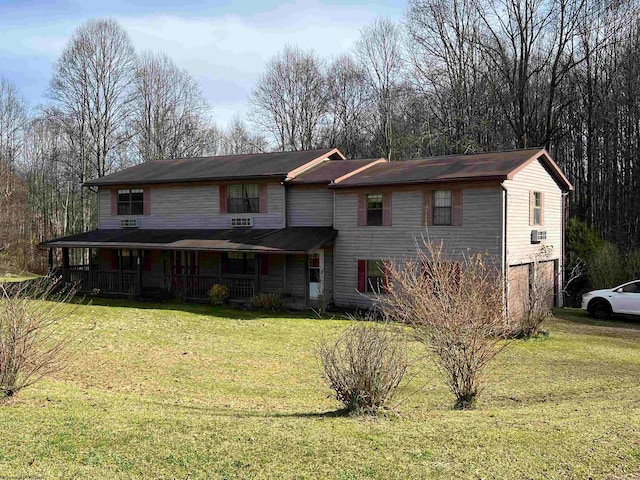 back of property featuring a porch and a yard