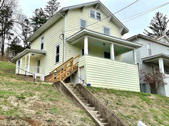 view of side of home featuring a porch