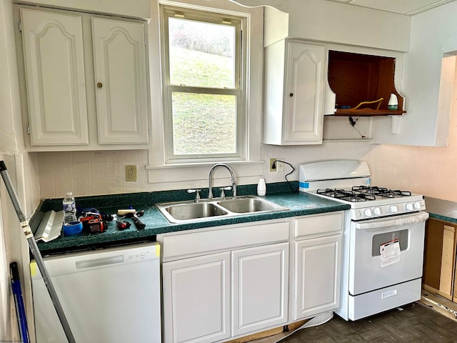 kitchen with white appliances, dark parquet floors, sink, tasteful backsplash, and white cabinetry