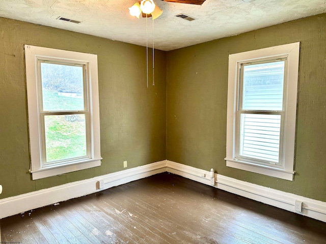 spare room with ceiling fan and hardwood / wood-style floors