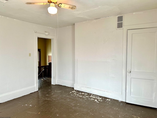 unfurnished room with ceiling fan