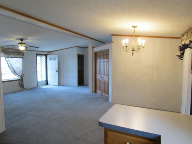 interior space with a textured ceiling, ceiling fan with notable chandelier, and crown molding