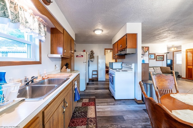 2302 Red Rock Rd, Rowlesburg, WV 26425 - kitchen featuring white appliances, under cabinet range hood, brown cabinets, a textured ceiling, and a sink