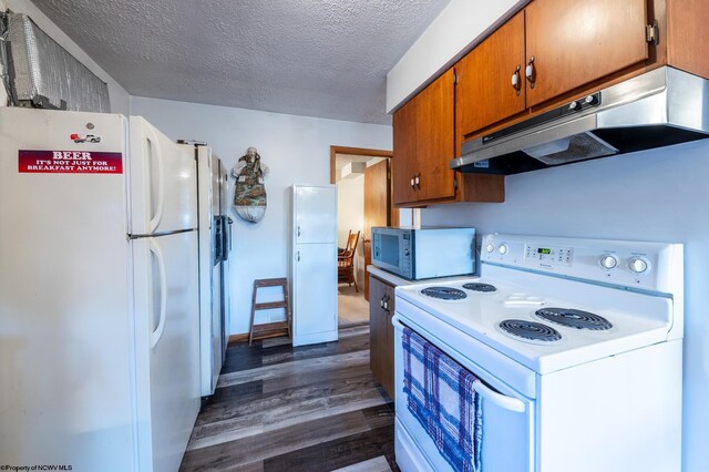 2302 Red Rock Rd, Rowlesburg, WV 26425 - kitchen featuring white appliances, under cabinet range hood, dark wood-style flooring, brown cabinets, and a textured ceiling