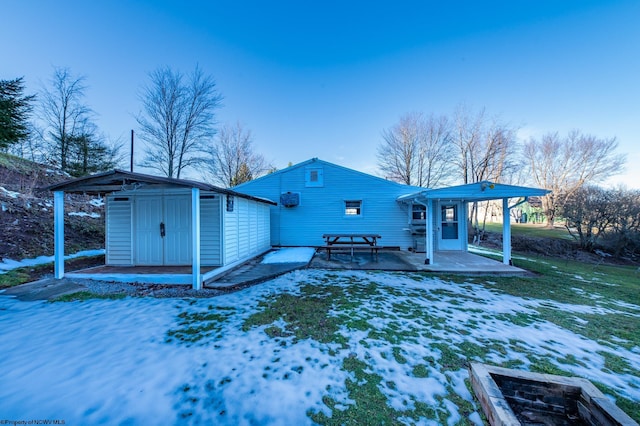 2302 Red Rock Rd, Rowlesburg, WV 26425 - snow covered rear of property featuring a patio area