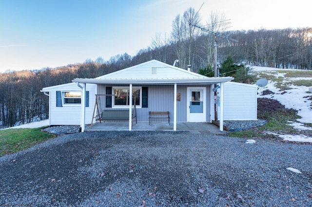 2302 Red Rock Rd, Rowlesburg, WV 26425 - bungalow-style house featuring covered porch, a view of trees, and metal roof