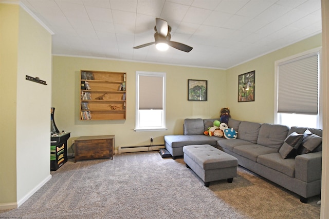 carpeted living room featuring crown molding, ceiling fan, and a baseboard heating unit