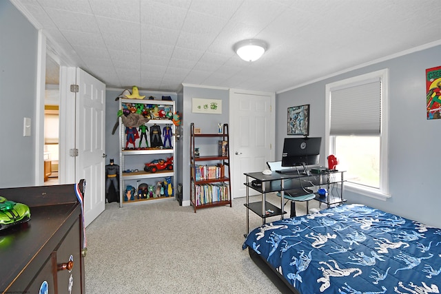 carpeted bedroom with ornamental molding