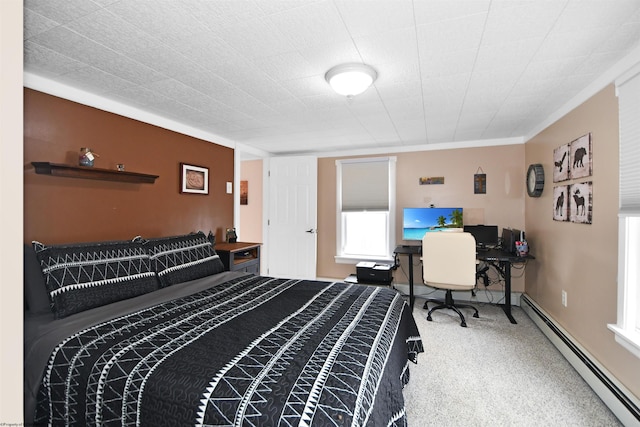 carpeted bedroom with a baseboard heating unit