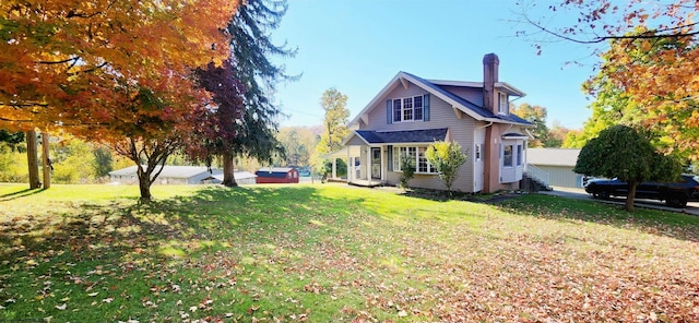 view of side of property featuring a lawn