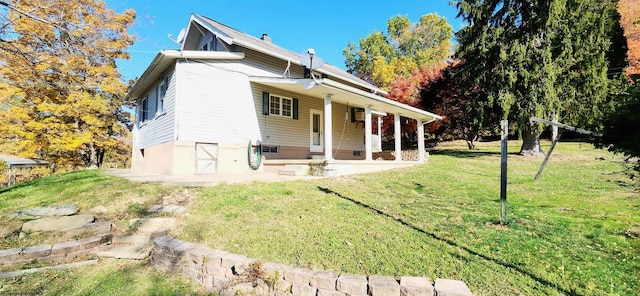 exterior space featuring a front lawn and a porch