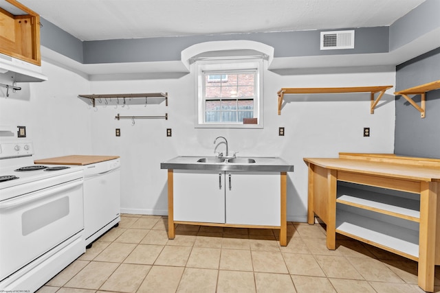 kitchen with white cabinets, white electric range oven, light tile patterned flooring, and sink