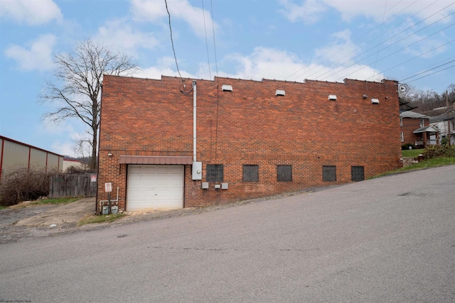 view of side of property with a garage