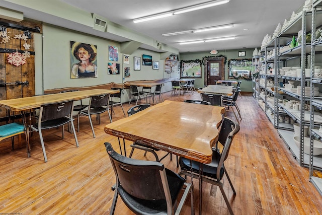 dining area with light wood-type flooring