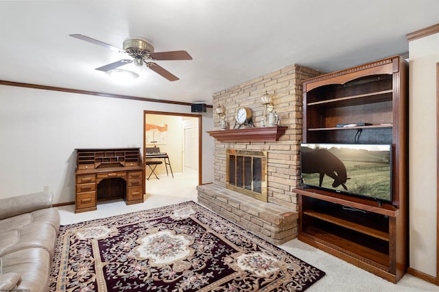 living room with light carpet, a fireplace, ceiling fan, and ornamental molding