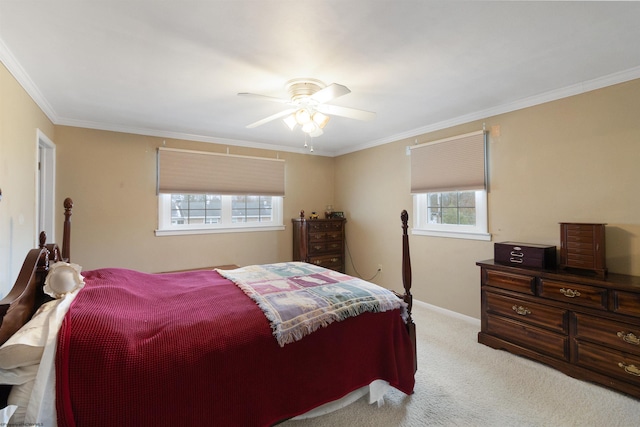 carpeted bedroom with ceiling fan and crown molding