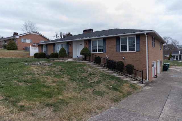 ranch-style house with a garage and a front lawn