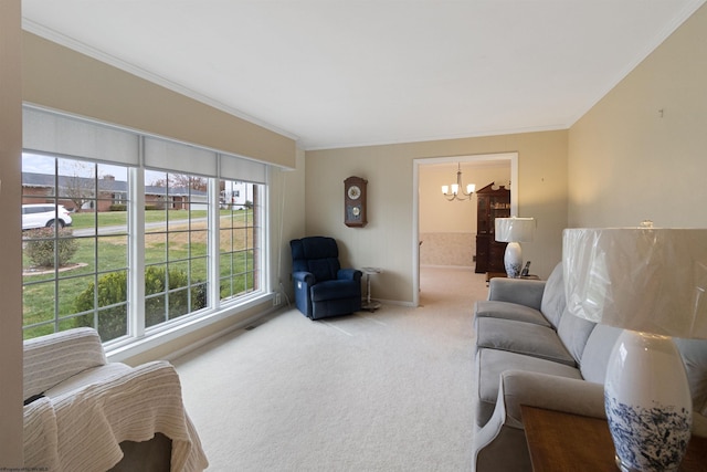 living room with crown molding, carpet, and a notable chandelier