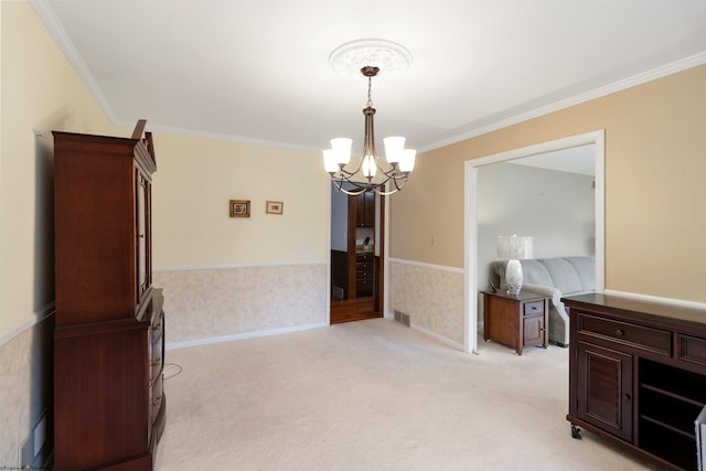 carpeted dining area featuring an inviting chandelier and crown molding