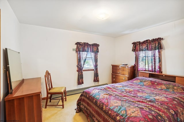 carpeted bedroom featuring a baseboard heating unit and multiple windows