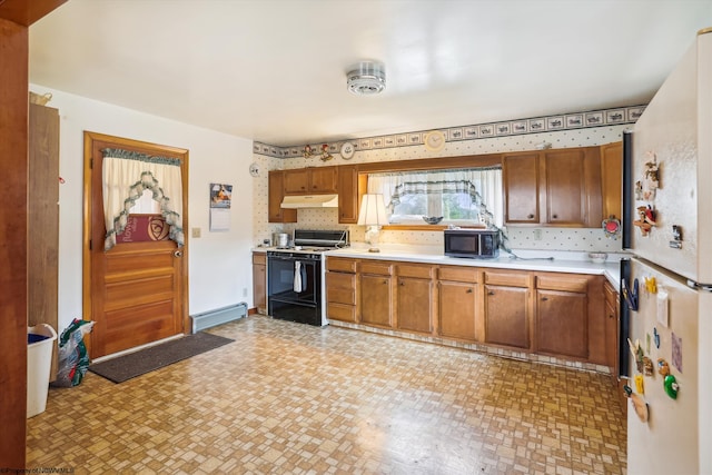 kitchen with black appliances and a baseboard heating unit