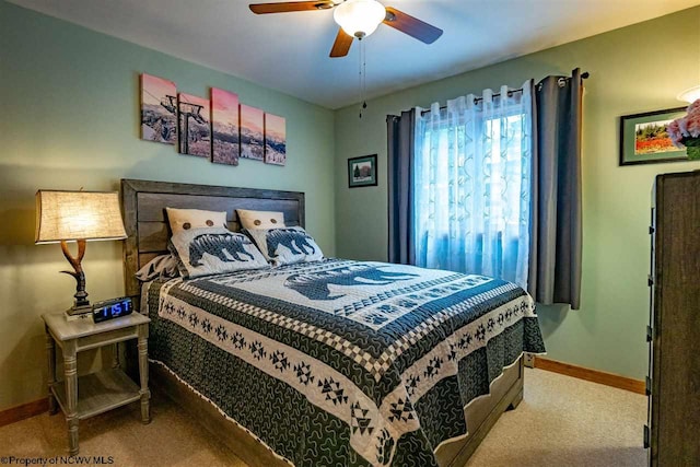 carpeted bedroom featuring ceiling fan